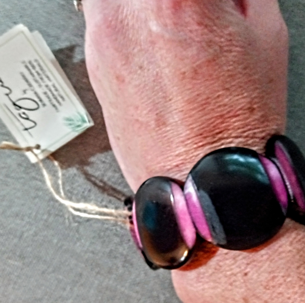 Black and pink circular bracelet